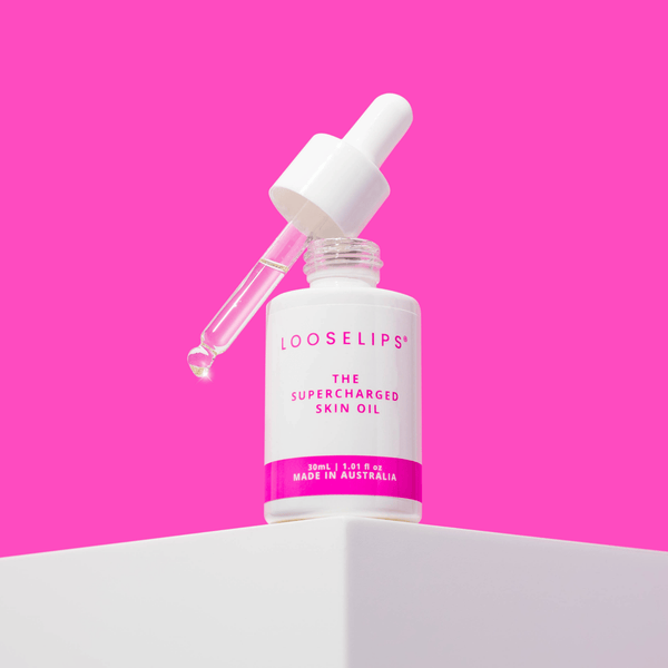 Bright pink photo of the looselips supercharged skin oil for glowing skin and bakuchiol for anti-aging benefits.