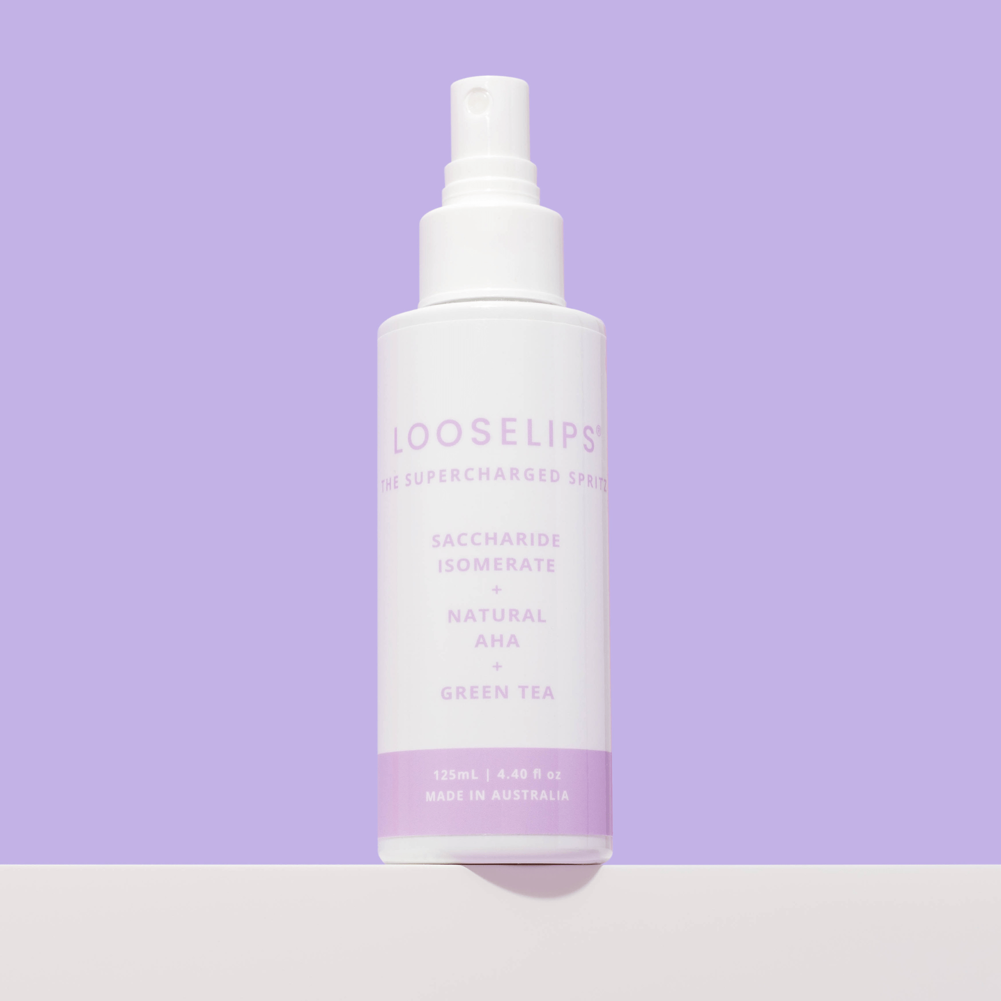 supercharged spritz with saccharide isomerate, natural aha and green tea against lilac purple background